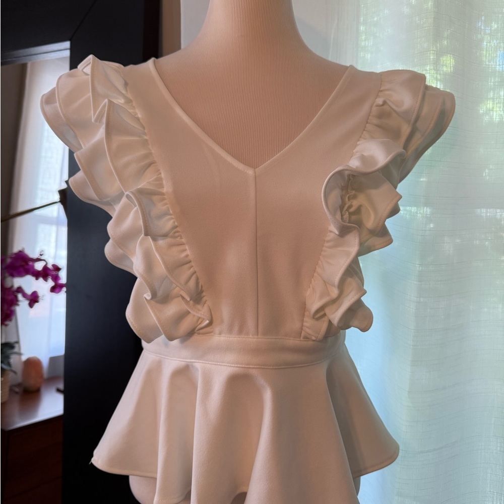 White Sleeveless Ruffled Peplum Blouse